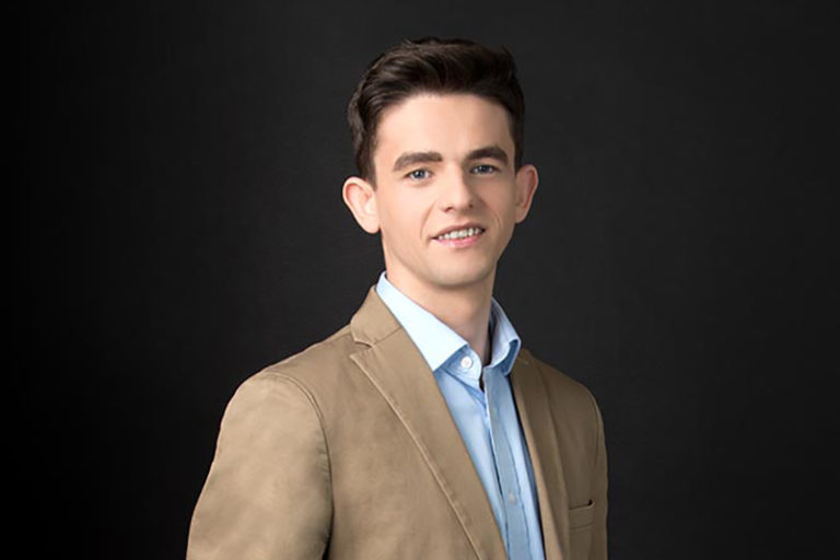 A man wearing a suit and tie