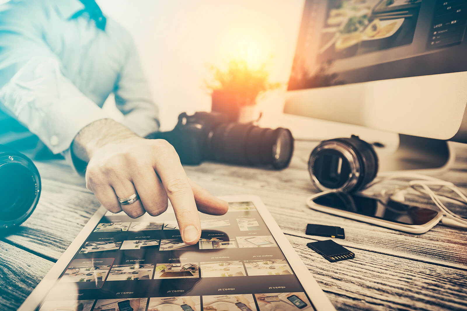 A person using a laptop computer sitting on top of a table