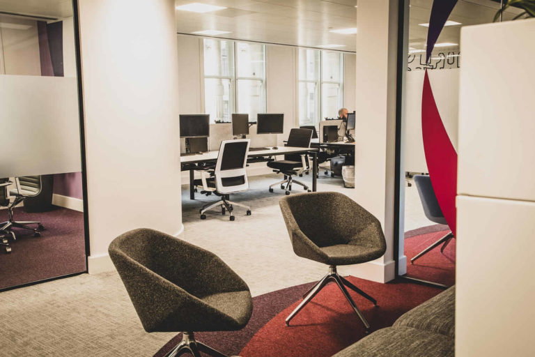 A living room filled with furniture and a large window