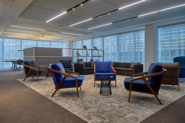 A room filled with furniture and a large window