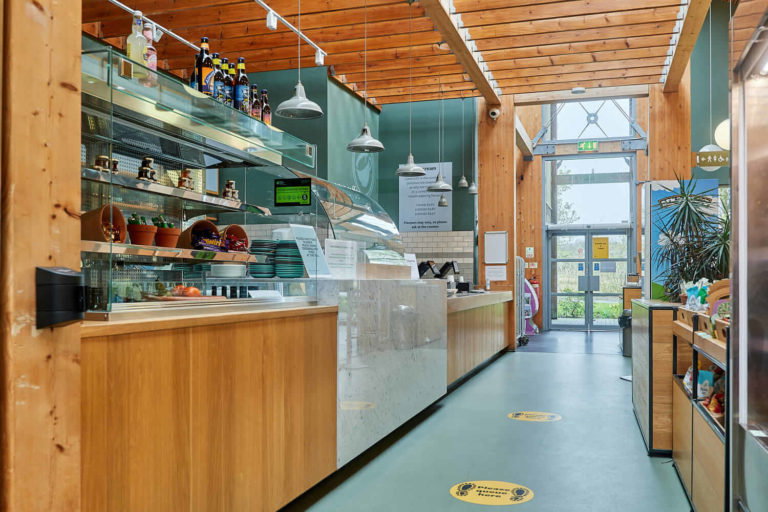 A kitchen area with a building in the background