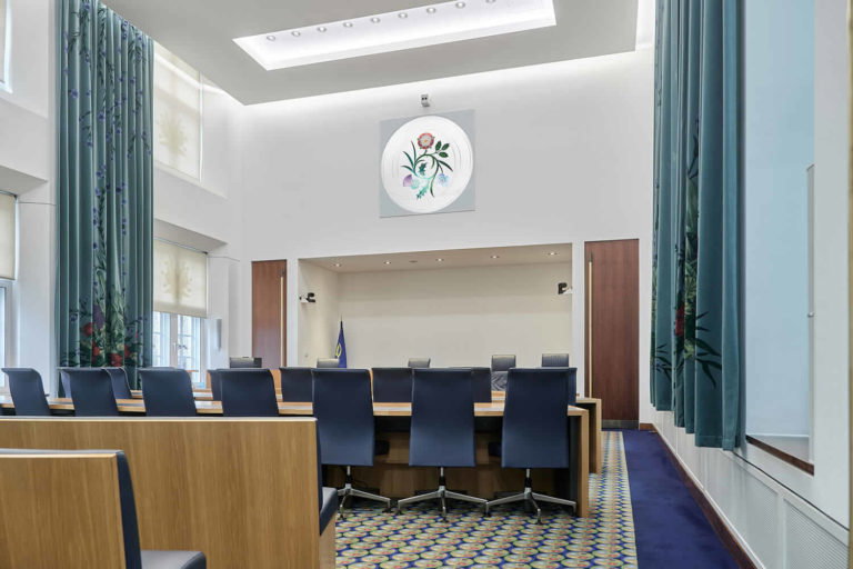 A dining room table in front of a window