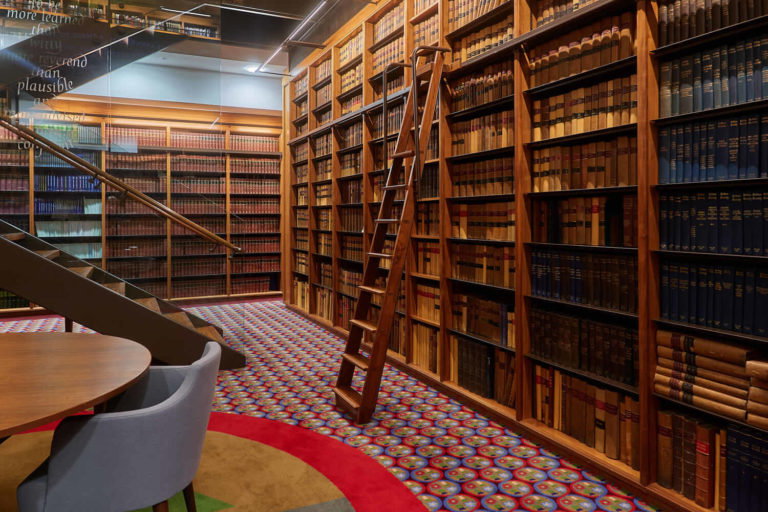 A dining room table and chairs in a library