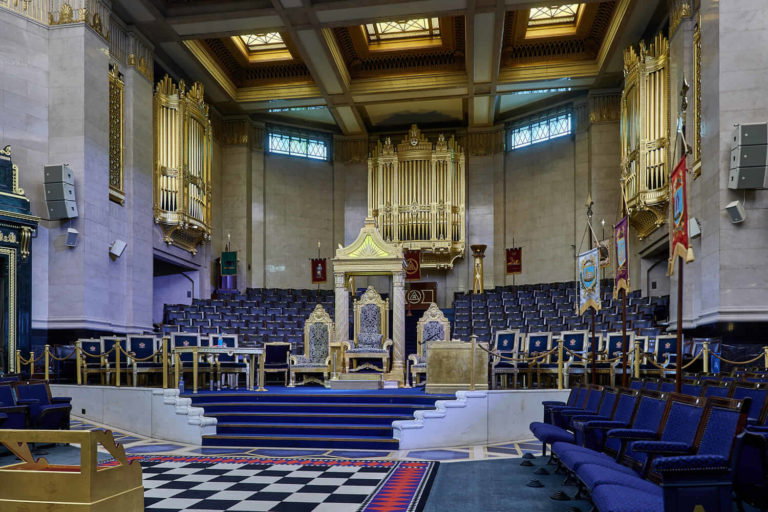 A chair sitting in front of a building