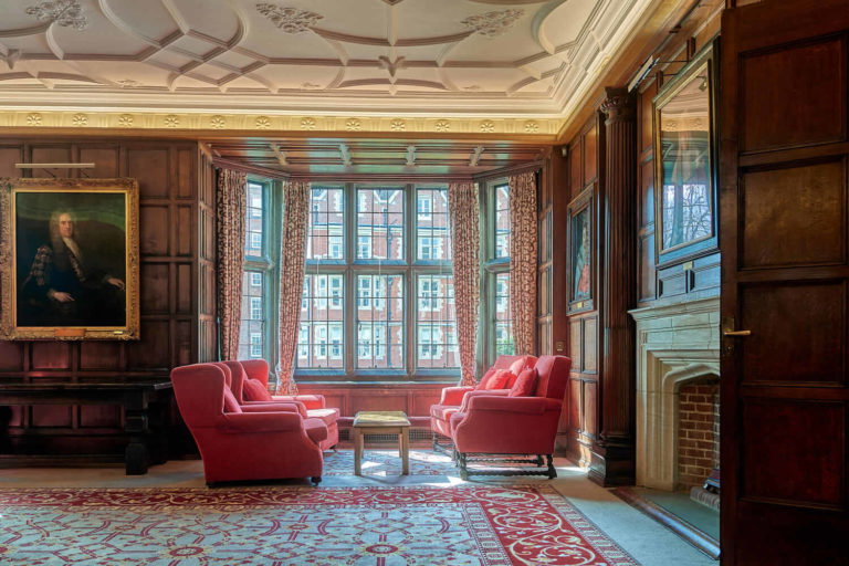 A living room filled with furniture and a large window