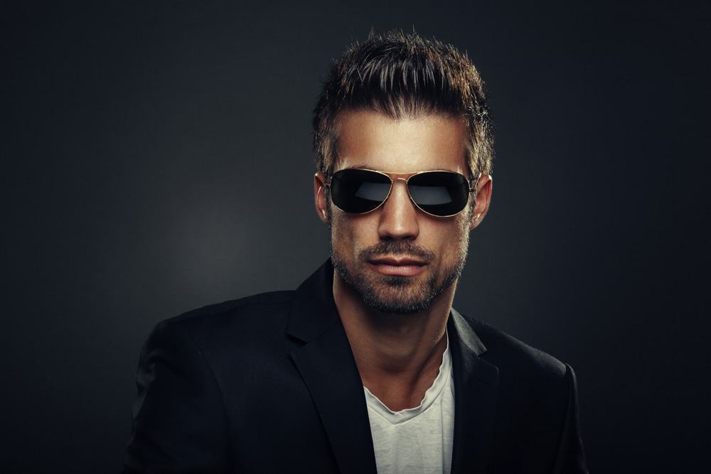 A man wearing sunglasses posing for the camera