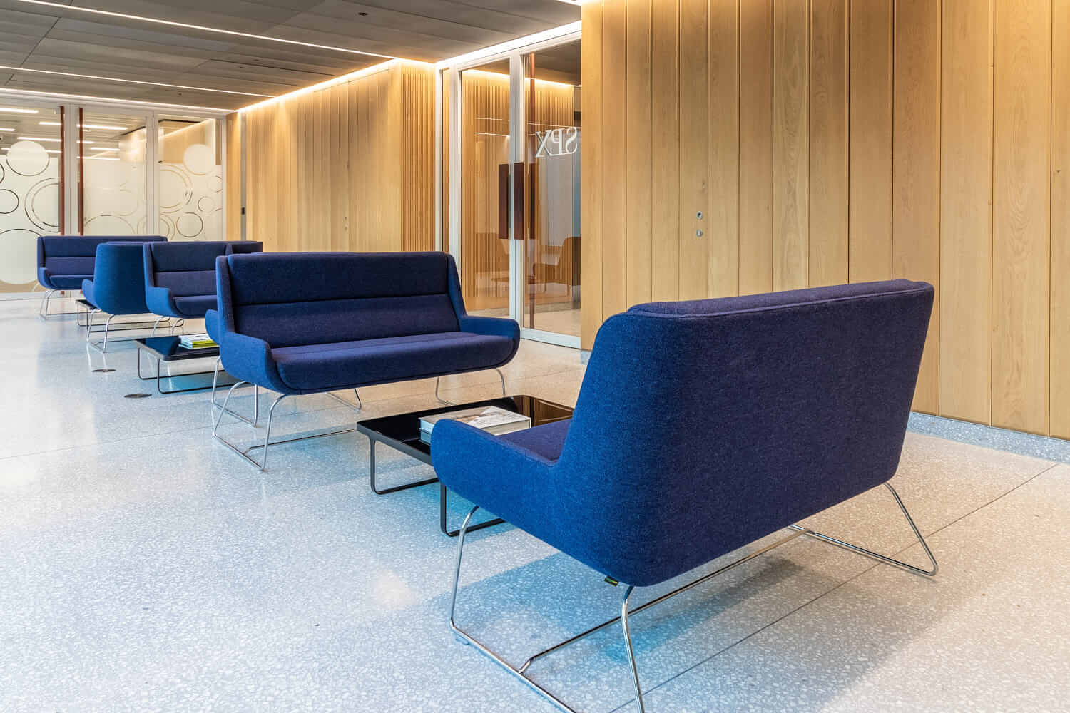 A room filled with furniture and a blue chair