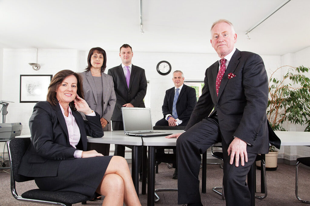 A group of people sitting posing for the camera