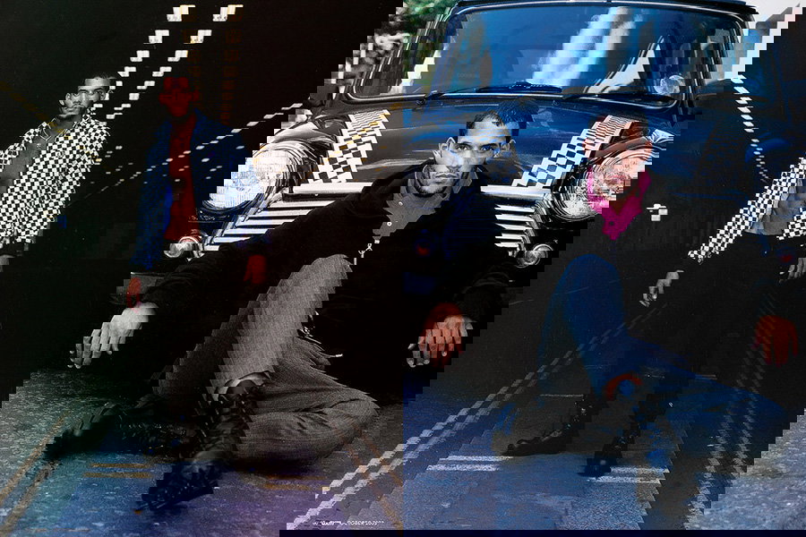 A group of people walking down the street