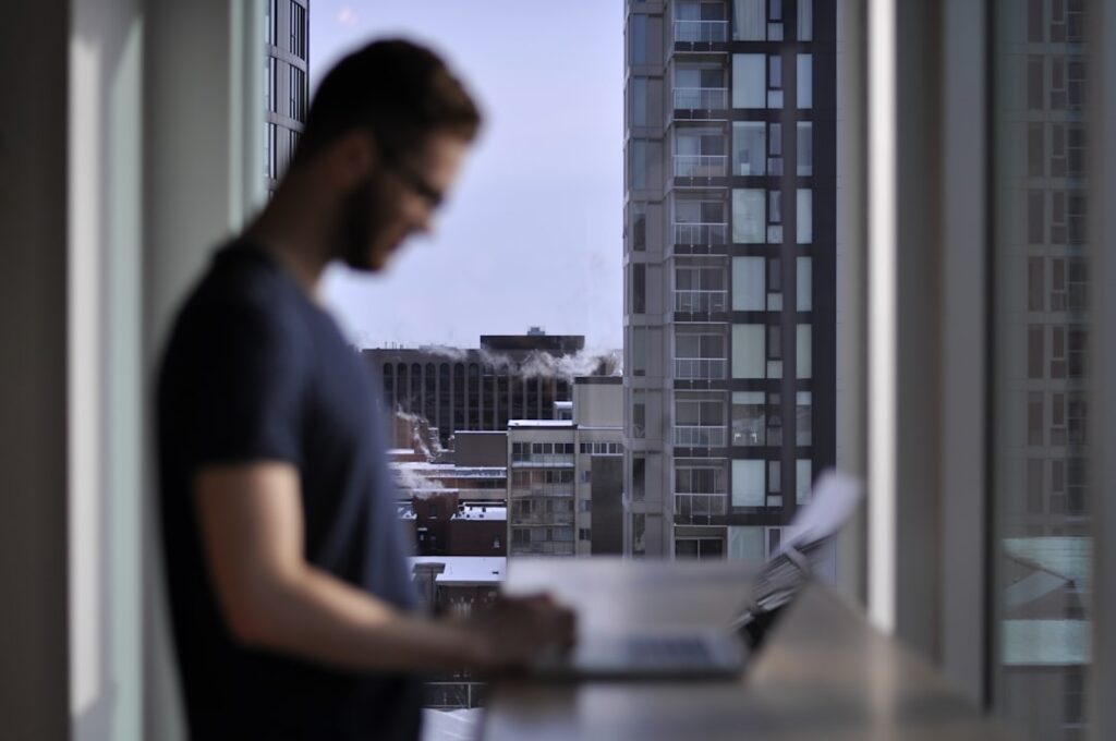 A man standing in front of a window