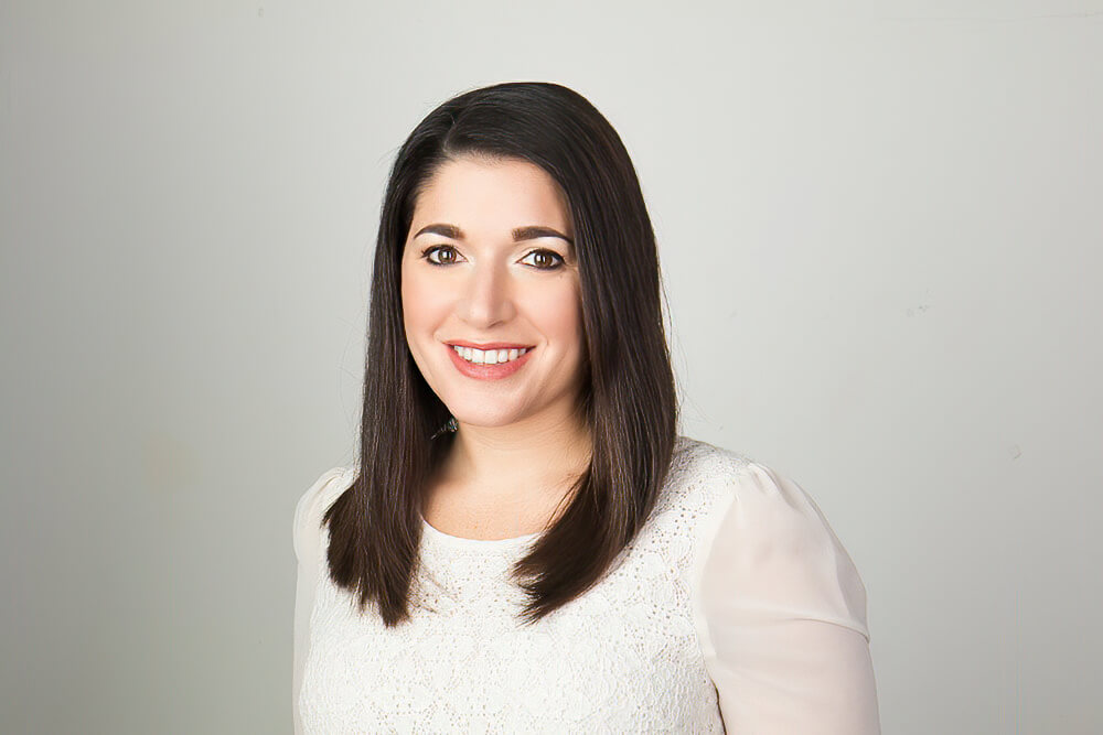 A woman smiling and posing for the camera