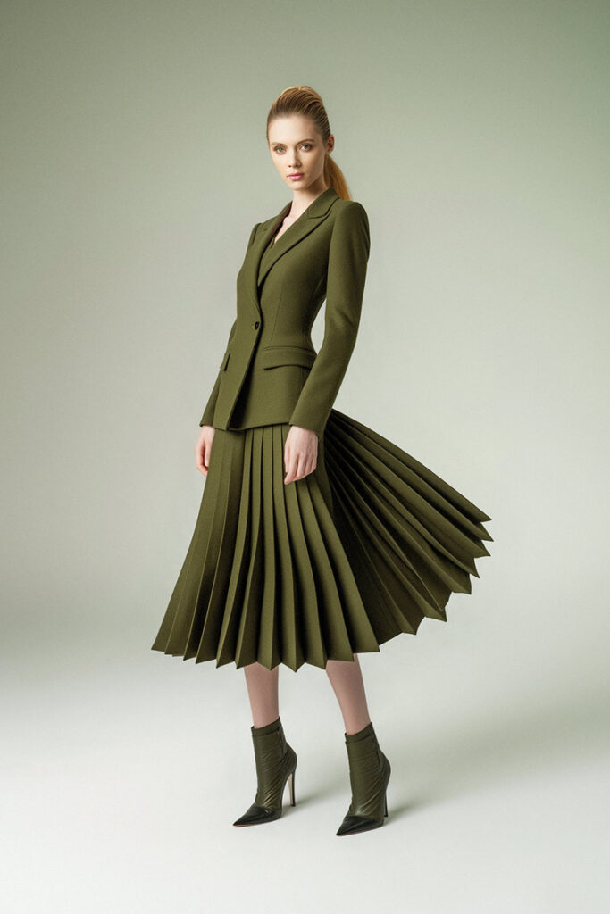 A woman wearing a suit and tie