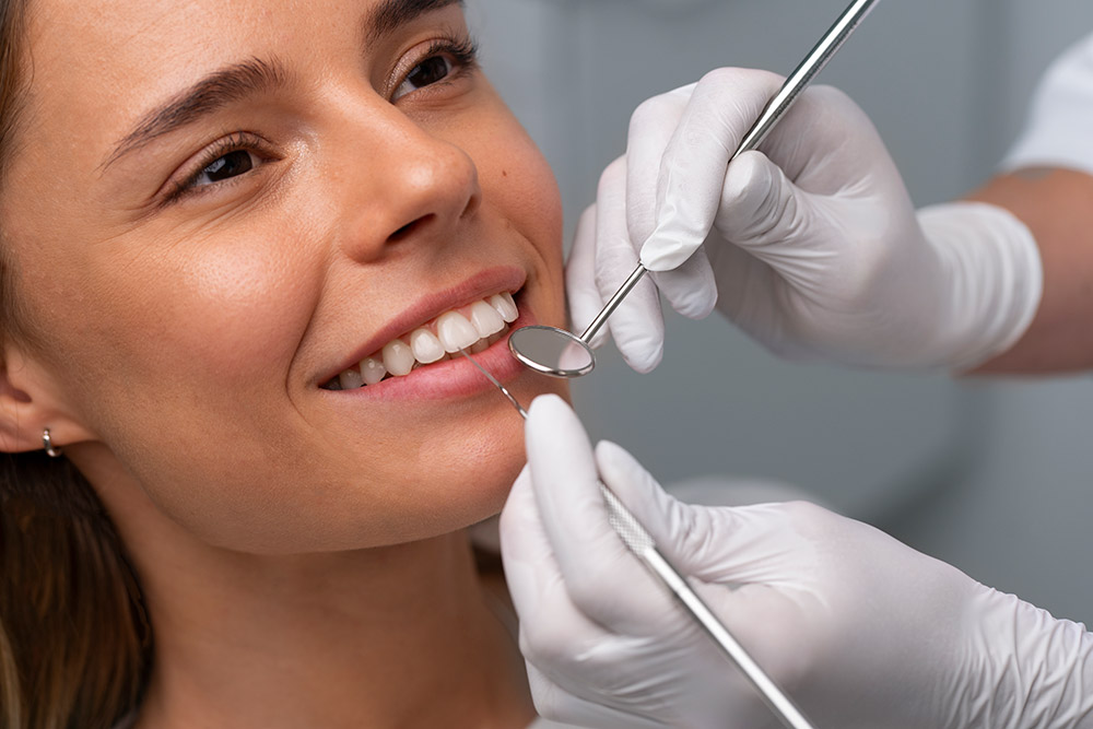 A close up of a woman brushing her teeth