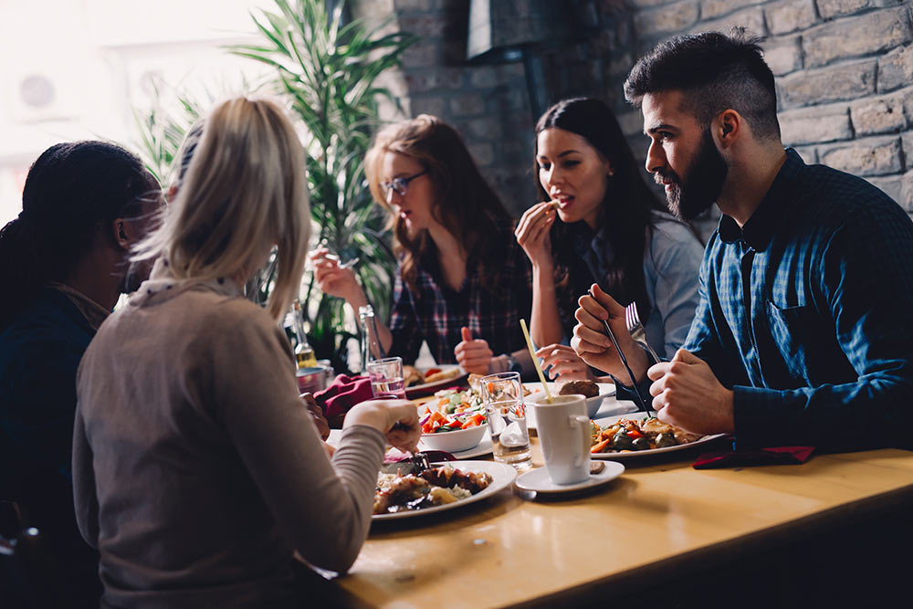 A group of people sitting at a table