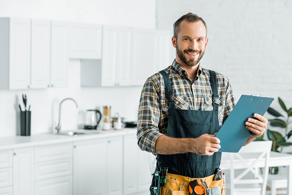 A person standing in a kitchen