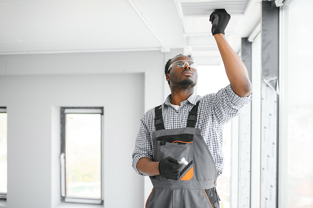 A man standing in front of a window