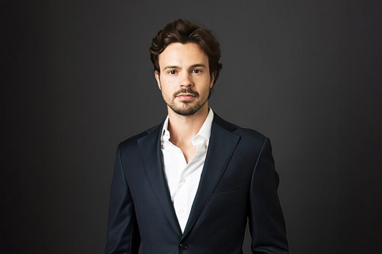 A man wearing a suit and tie