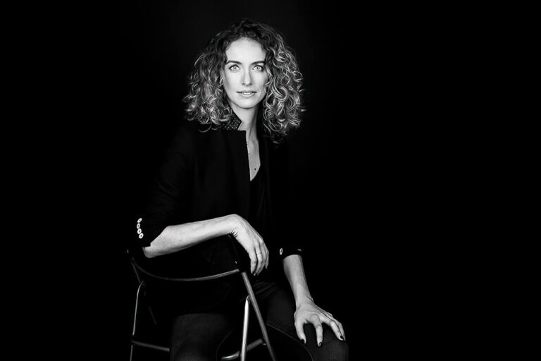 A woman in a dark room