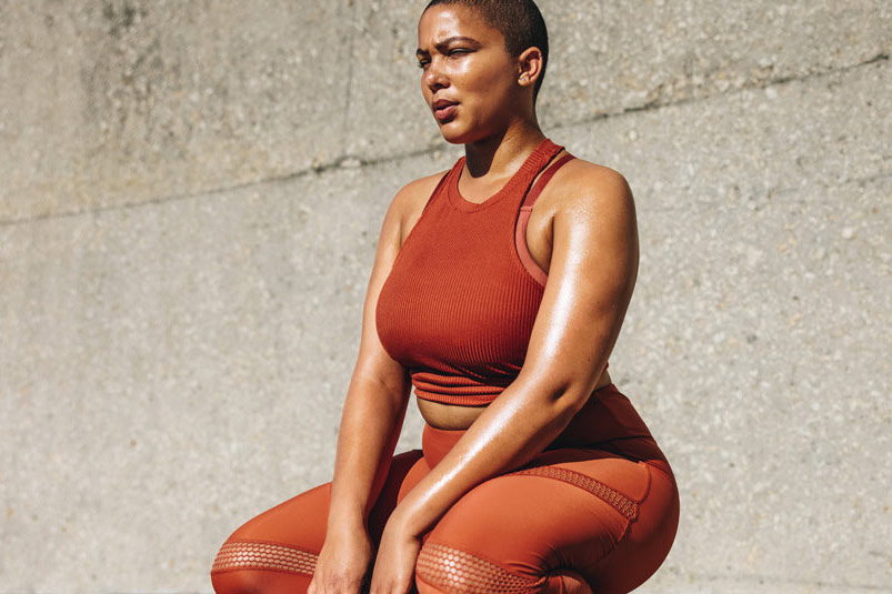 A woman standing in front of a building