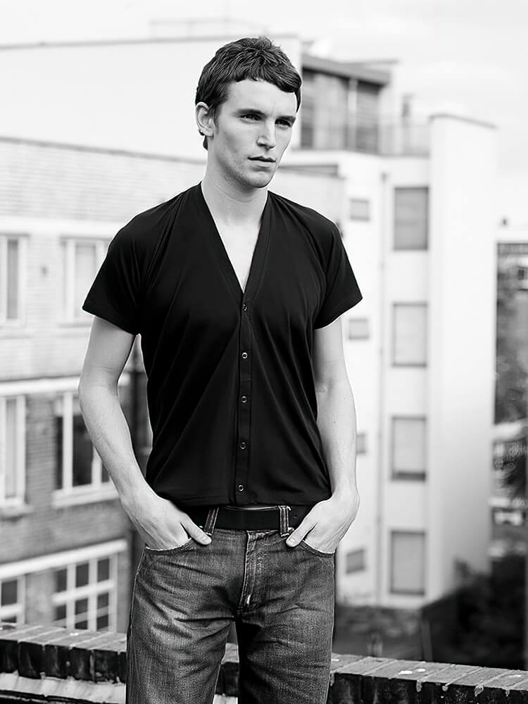 A man standing in front of a building