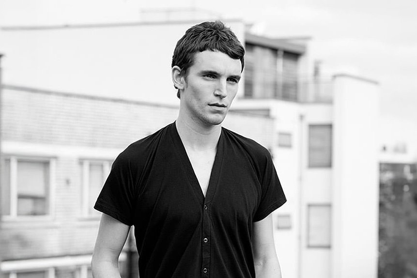 A man standing in front of a building