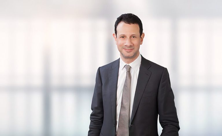 A man wearing a suit and tie