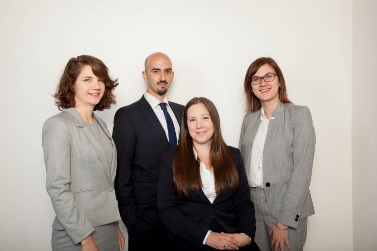 A group of people posing for the camera