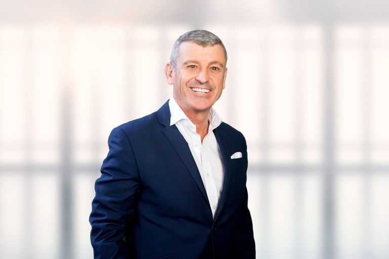 A man wearing a suit and tie