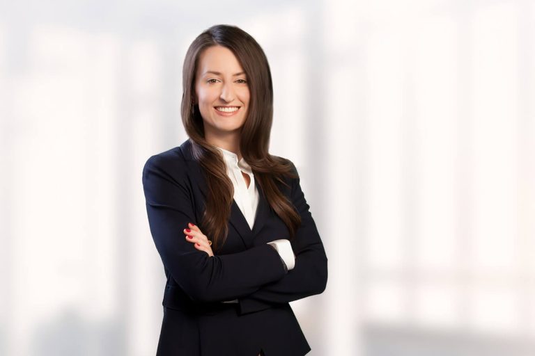 A woman wearing a suit and tie