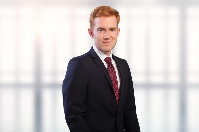 A man wearing a suit and tie