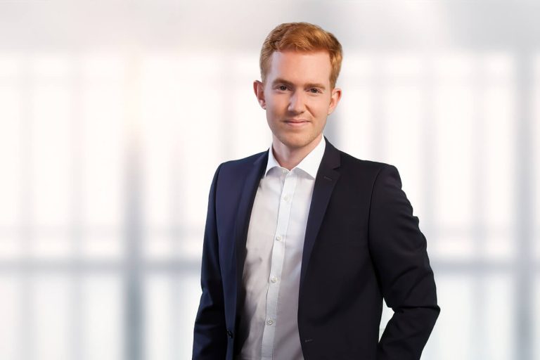 A man wearing a suit and tie