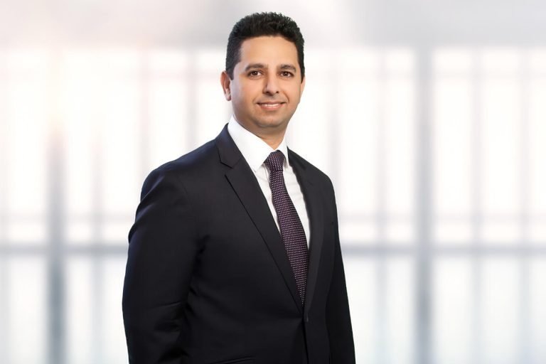 A man wearing a suit and tie