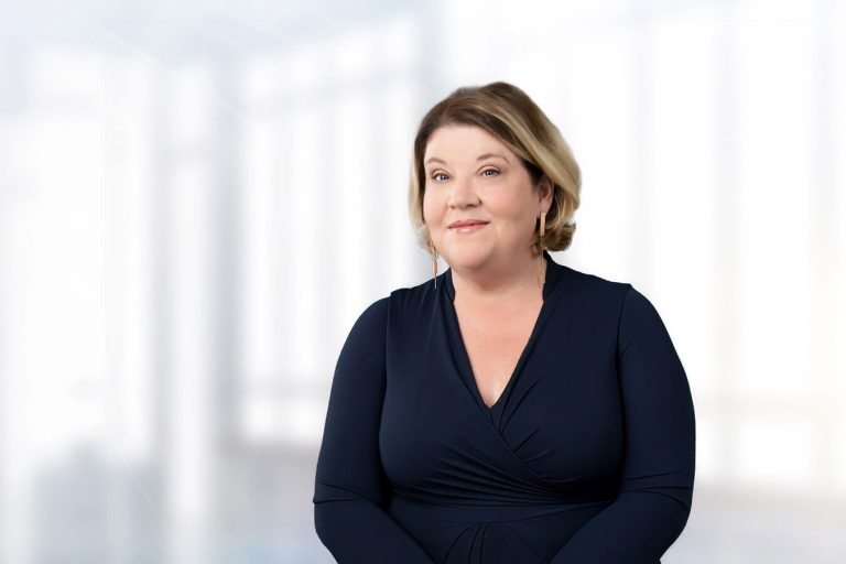 Catherine Gannon standing in front of a window