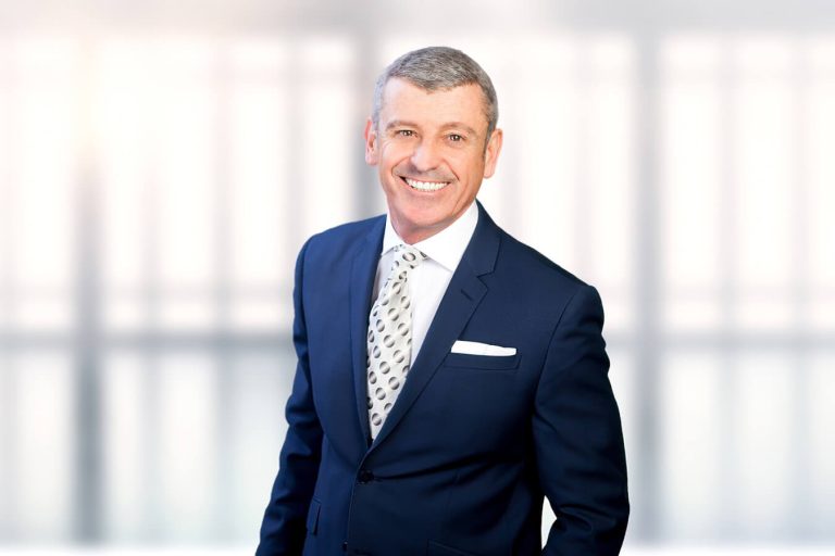 A man wearing a suit and tie