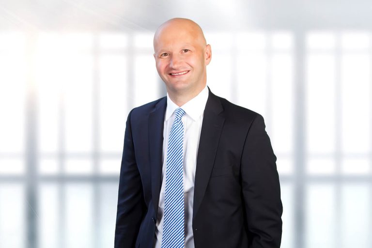 A man wearing a suit and tie