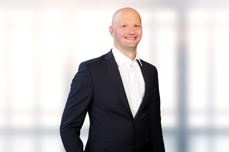 A man wearing a suit and tie