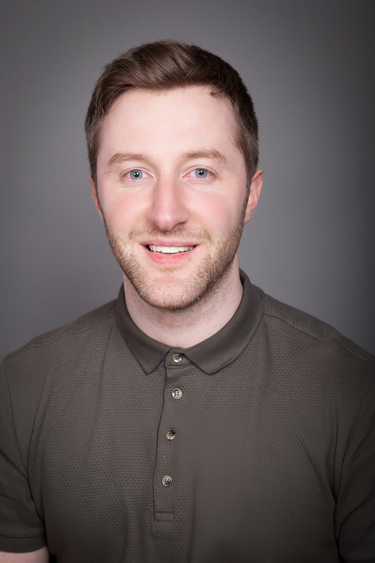 A man wearing glasses and looking at the camera