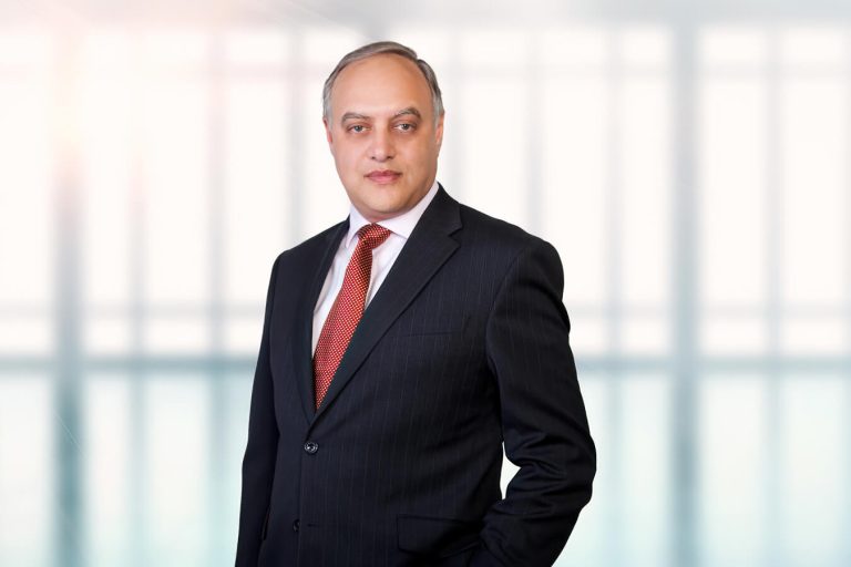 A man wearing a suit and tie