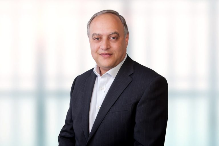 A man wearing a suit and tie