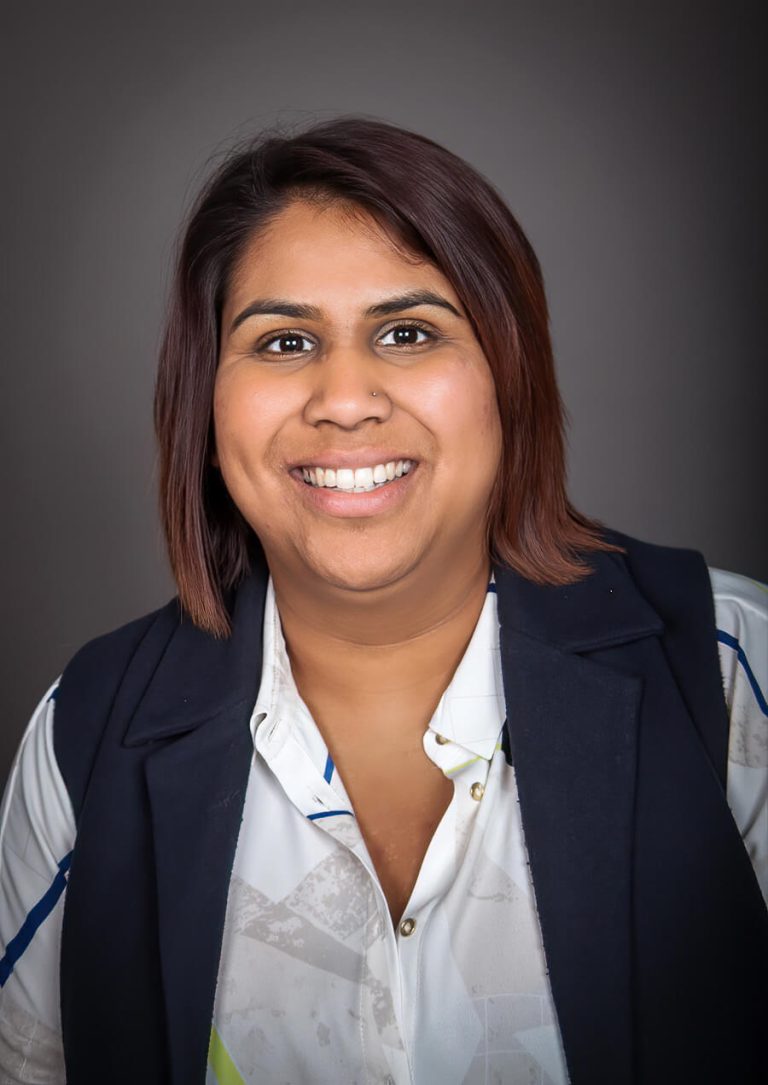 A woman smiling for the camera