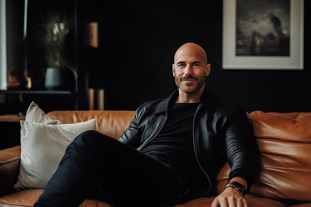 A person sitting on a leather couch