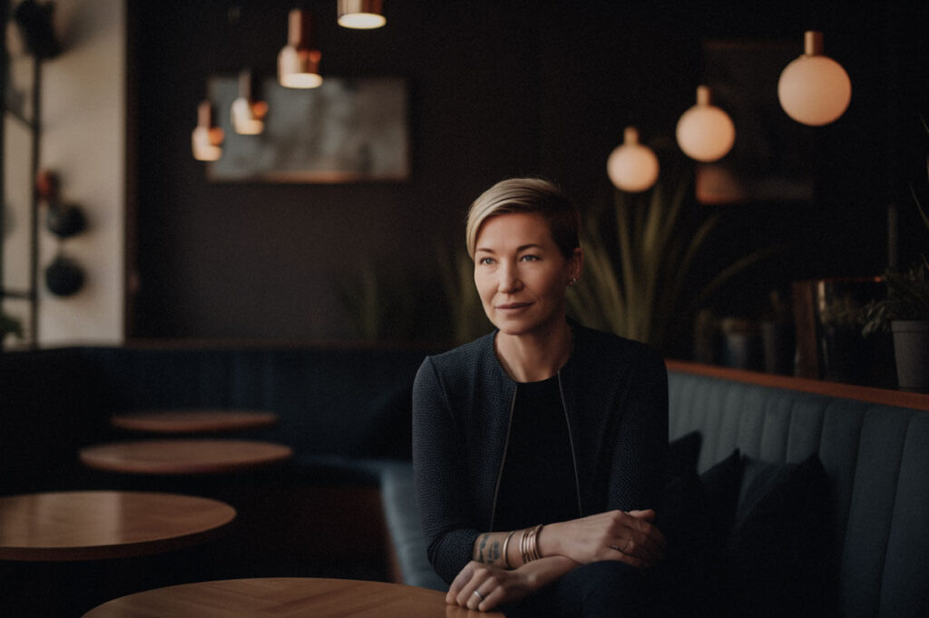 A person sitting at a table in a restaurant