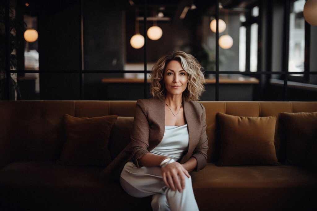 Becky O'Donohue sitting on a leather couch